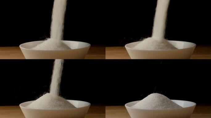 Sugar pouring into a ball