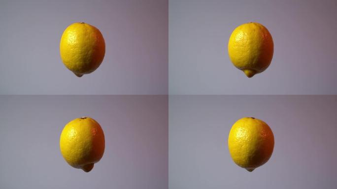 柠檬。柠檬水果漂浮在空中并绕垂直轴旋转的视频。