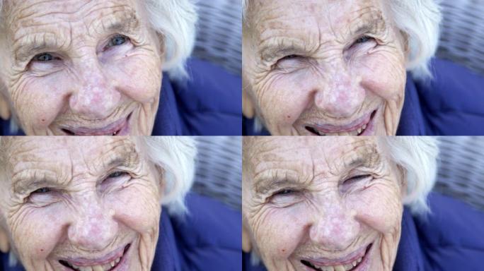 在户外的夏天，一个美丽，敏锐，聪明的老年高加索妇女独特的斑点漂亮的眼睛和脸的笑声