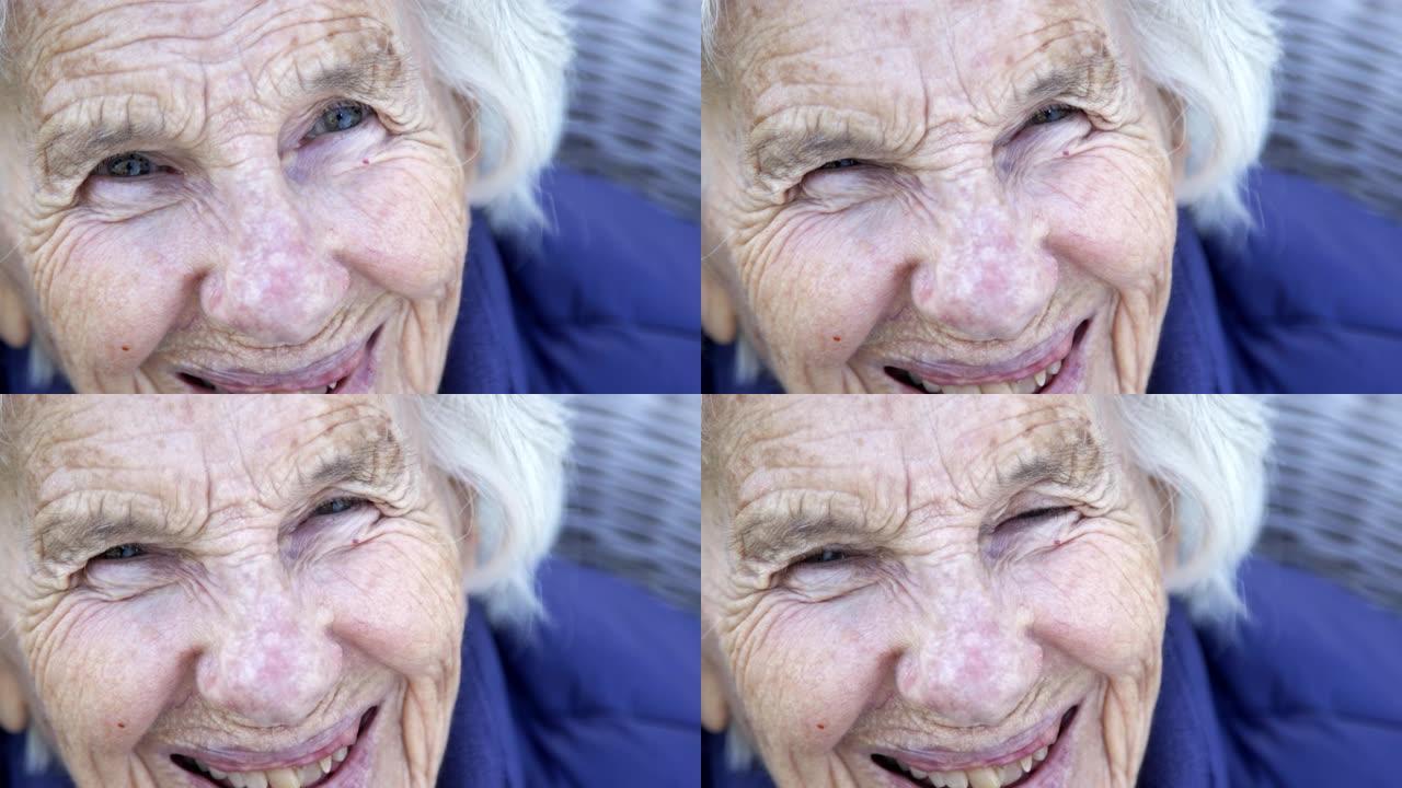 在户外的夏天，一个美丽，敏锐，聪明的老年高加索妇女独特的斑点漂亮的眼睛和脸的笑声