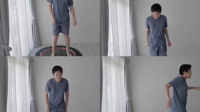 亚洲青春期男孩在家跳上迷你蹦床，健康生活方式理念。