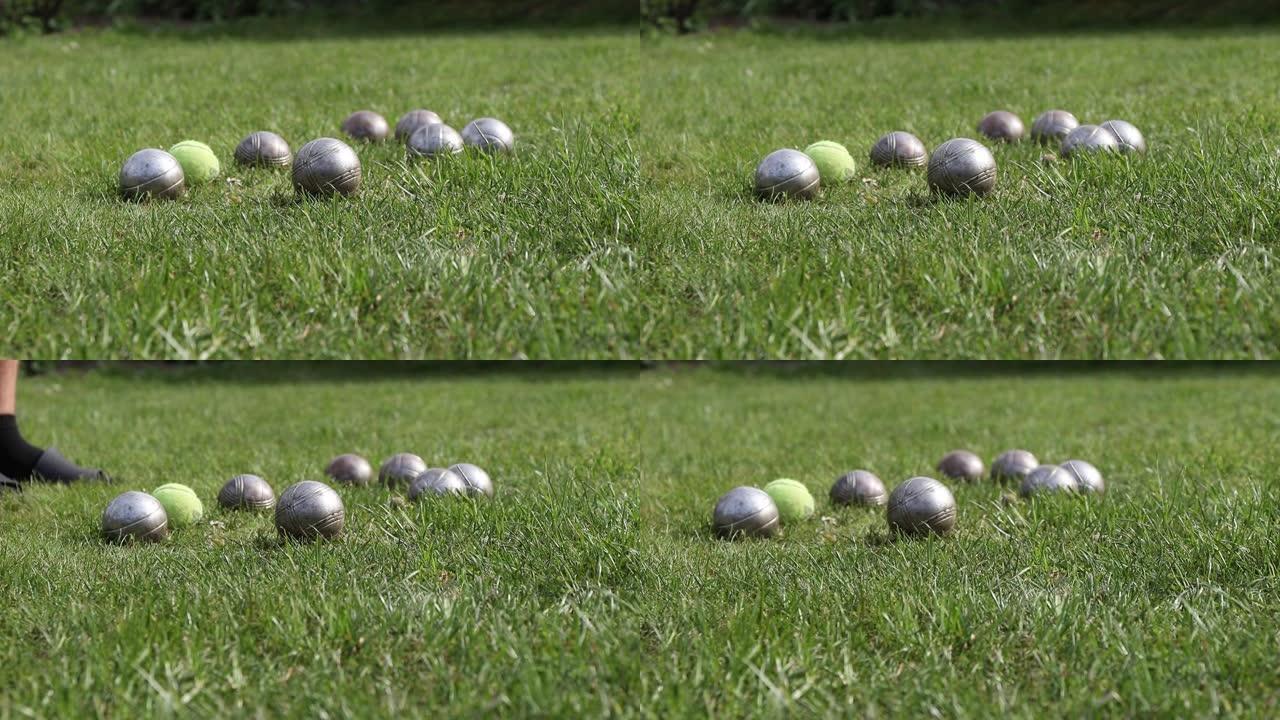 令人兴奋和伤脑筋的游戏称为Petanque。木球周围几乎是金属球，这意味着目标。最后一个球被扔了。所