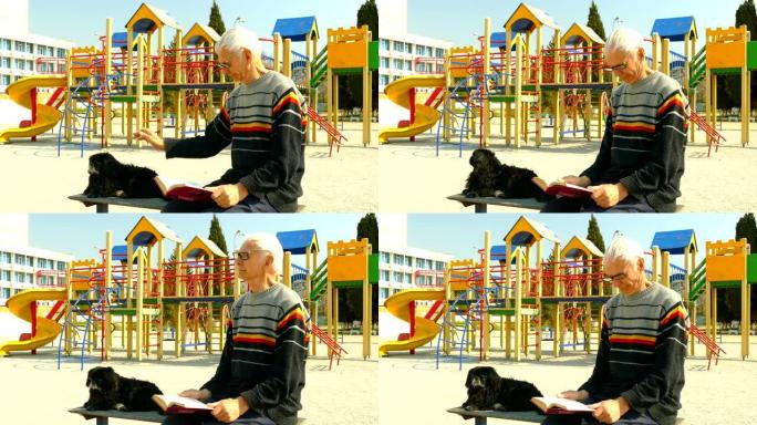 老人在空荡荡的操场上看书，和狗在一起