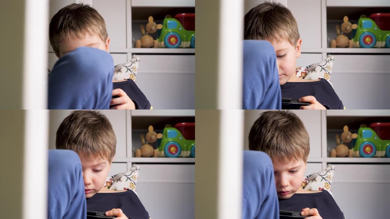 男孩在手机上玩游戏。眼病。眼科。Z世代和新技术。网络安全应用。让孩子安全上网。父母的网络安全