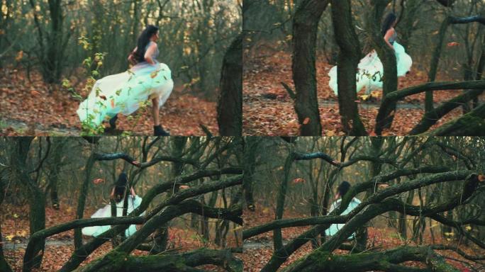 后视神秘的女人穿着奢华的蓬松浅绿色连衣裙逃跑了。哥特式秋天森林中的神话般的公主。真丝织物深色长发在运