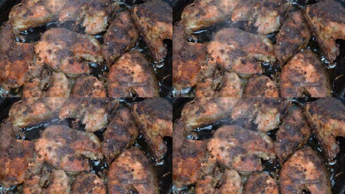 在油锅中用面粉油炸红鲑鱼鱼的特写镜头。烤太平洋红鲑鱼 -- 传统亚洲美食