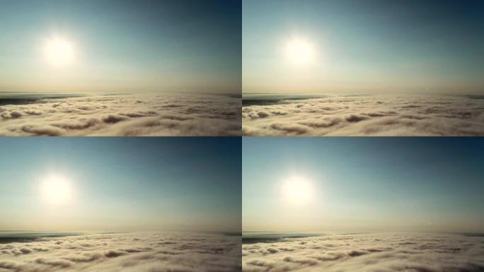 4k延时低角度视角云景，风吹着白色蓬松的云，在晴朗的天空中通过太阳，阳光穿过云。
