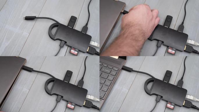 将USB C型适配器或集线器连接到带有各种附件的笔记本电脑-pendrive，hdmi，以太网，存储