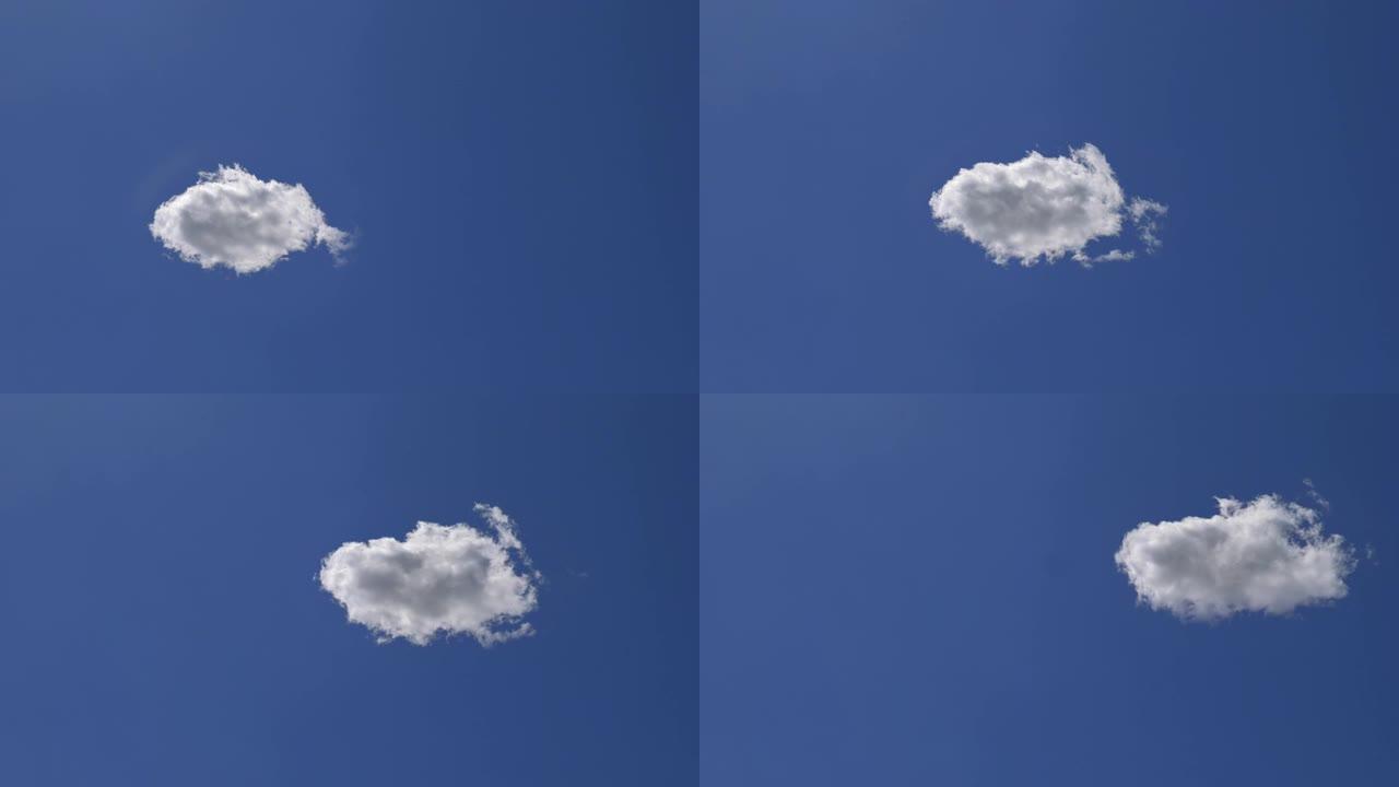 滚滚孤云孤立在晴朗的蓝天时间流逝。纯度和轻盈