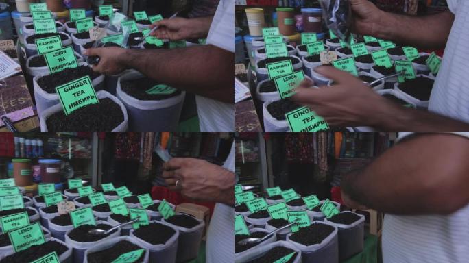 男子在街上卖不同种类的印度叶茶