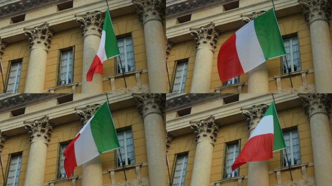 意大利国旗在有柱子的建筑上飘扬