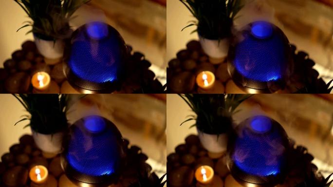4k，芳香电油扩散器灯，房间木桌上的蜡烛。芳香疗法。