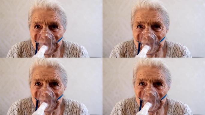 一位戴着医用呼吸面罩的老年妇女的特写肖像。