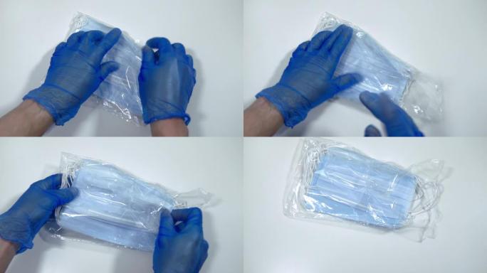 用乳胶医用手套拿起的外科口罩
