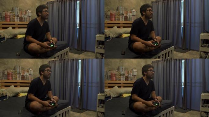 亚洲男子使用视频游戏机控制操纵杆