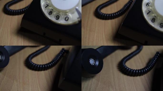 黑色背景上的复古黑色拨号电话