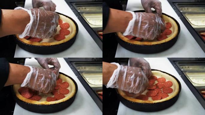深盘披萨制作短片。放入意大利辣香肠并加入奶酪