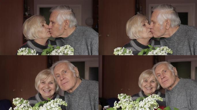 一个快乐的祖父和祖母的肖像。奶奶gandpa接吻