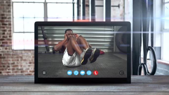 平板电脑动画显示一个非洲裔美国人在锻炼。冠状病毒传播