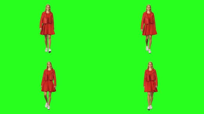 金发女孩平静地走在绿屏背景上。色度键，4k镜头。前视图