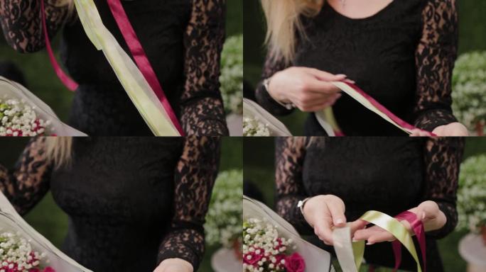 职业女性花店解开红丝带，用剪刀剪开以包装花束