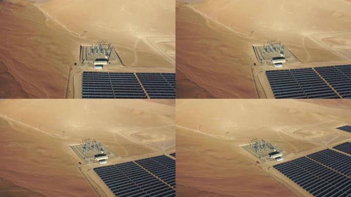 太阳能电池板的鸟瞰图和背景阿塔卡马沙漠中的山可再生能源