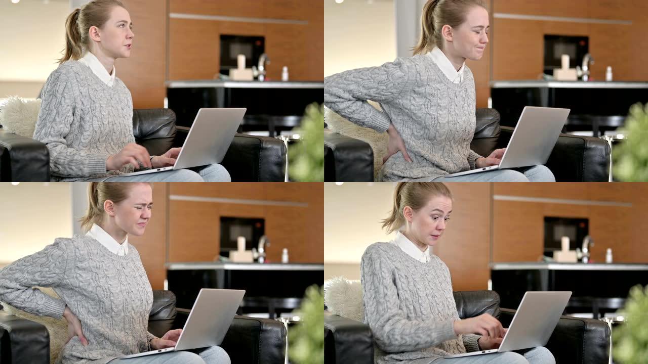 年轻女子背痛在家用笔记本电脑工作