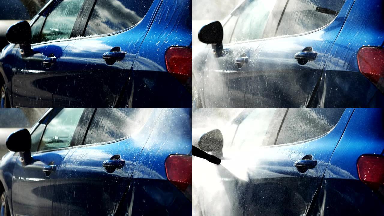蓝色汽车在闪亮的日子里用喷水水洗手