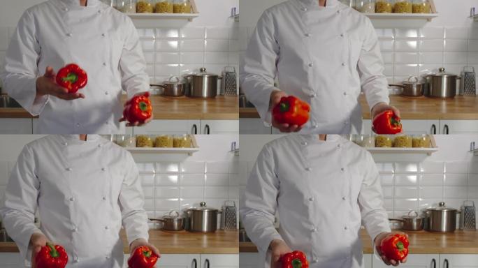 慢动作: 炊具在厨房里摆弄红辣椒的铃铛