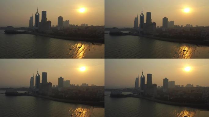 日落时间青岛市著名海滩湾空中全景4k中国