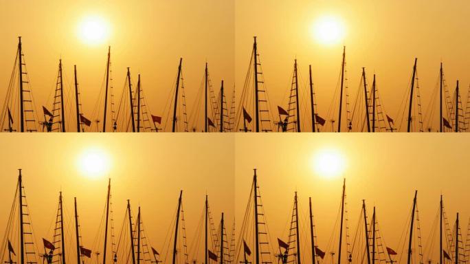 日落时船和船的桅杆。越南
