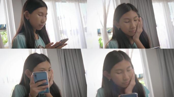亚洲女孩在家中使用智能手机，生活方式和居家理念。