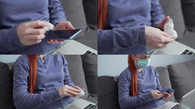 一个女人用抗菌抹布摩擦智能手机。