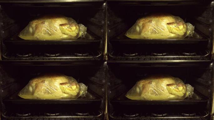 在烤箱中拍摄美味的炸鸡和土豆，下面是肉汤