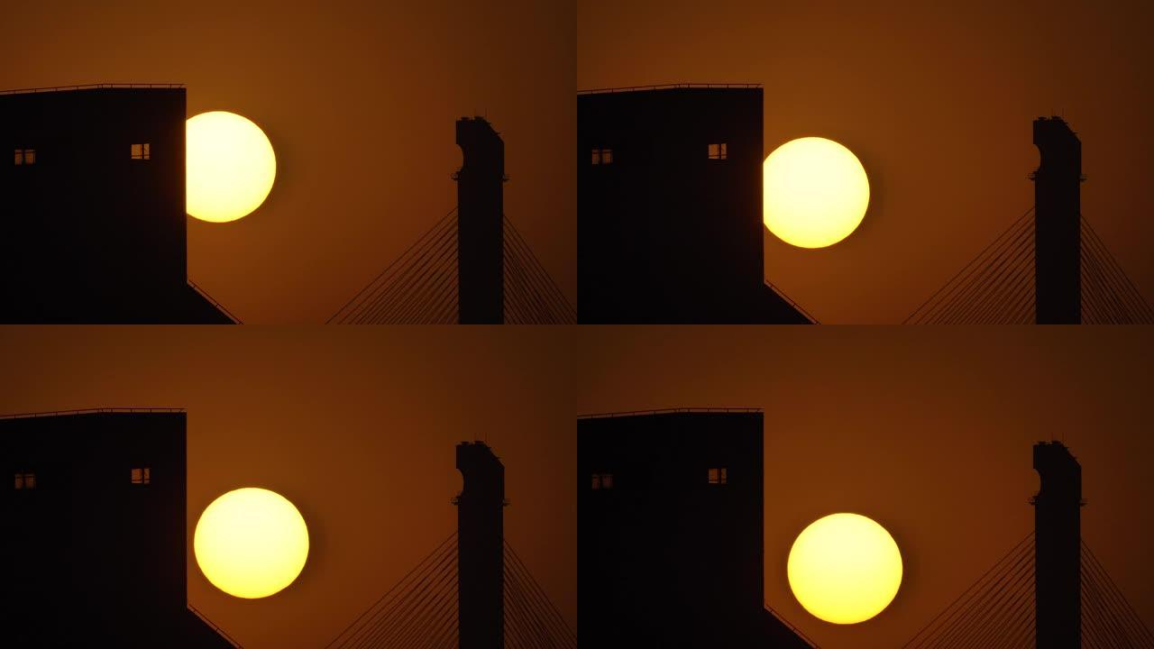 黄昏时，太阳落下，日落天空和剪影建筑背景的延时镜头，远摄镜头4k视频，b卷镜头。