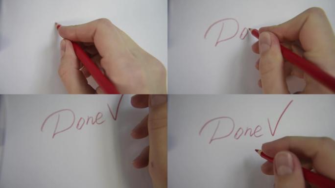 用红色铅笔的手，写下完成的单词