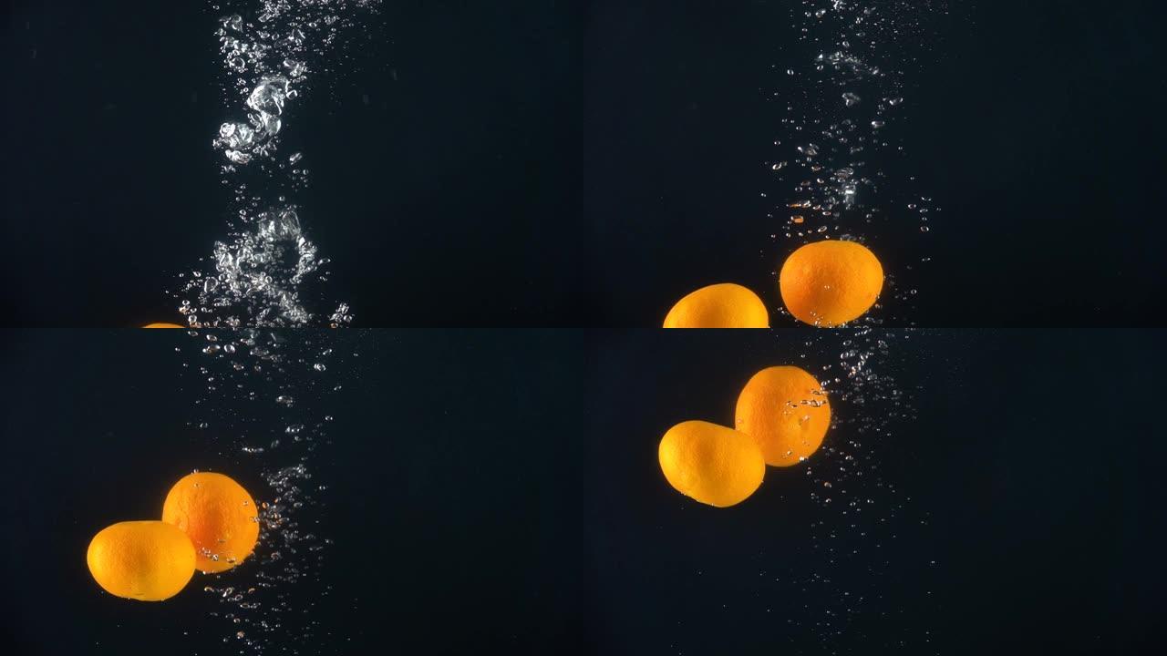 橘子掉进水里。慢动作