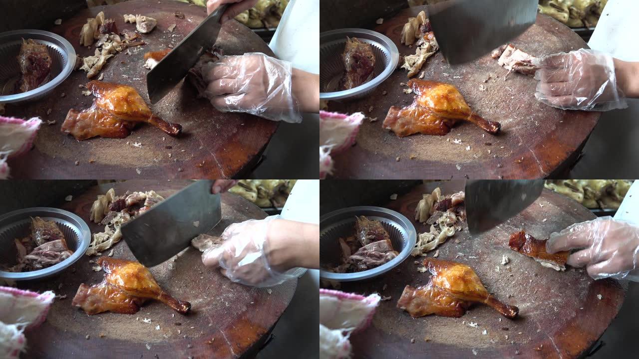 中国餐厅的厨师正在切烤北京烤鸭。中国北京