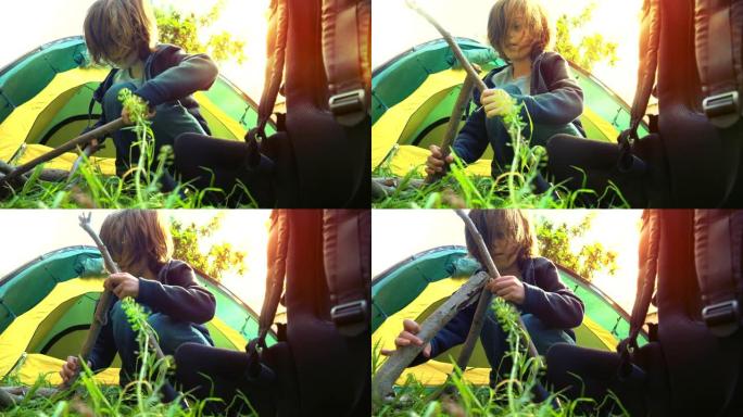 一个在大自然中露营的男孩。