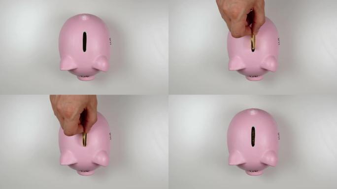 俯视图: 手将硬币扔进粉红猪钱箱