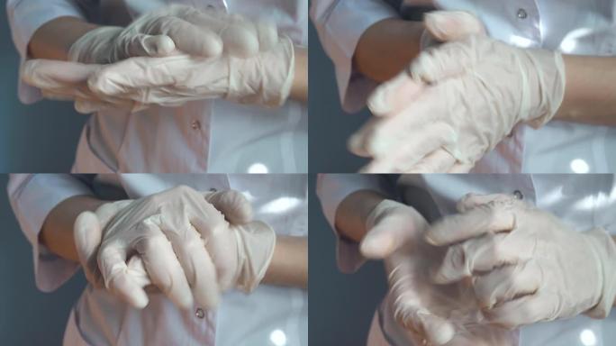 一名戴着乳胶手套的医生用凝胶消毒双手以去除细菌