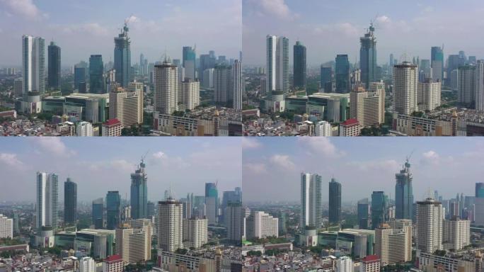晴天雅卡达市市区现代摩天大楼建筑空中全景4k印度尼西亚