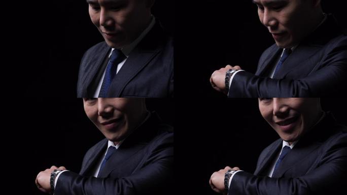 亚洲商人礼物适合礼服。中国男性外观现代智能手表。商务人士、时尚潮流和技术数字化的概念。
