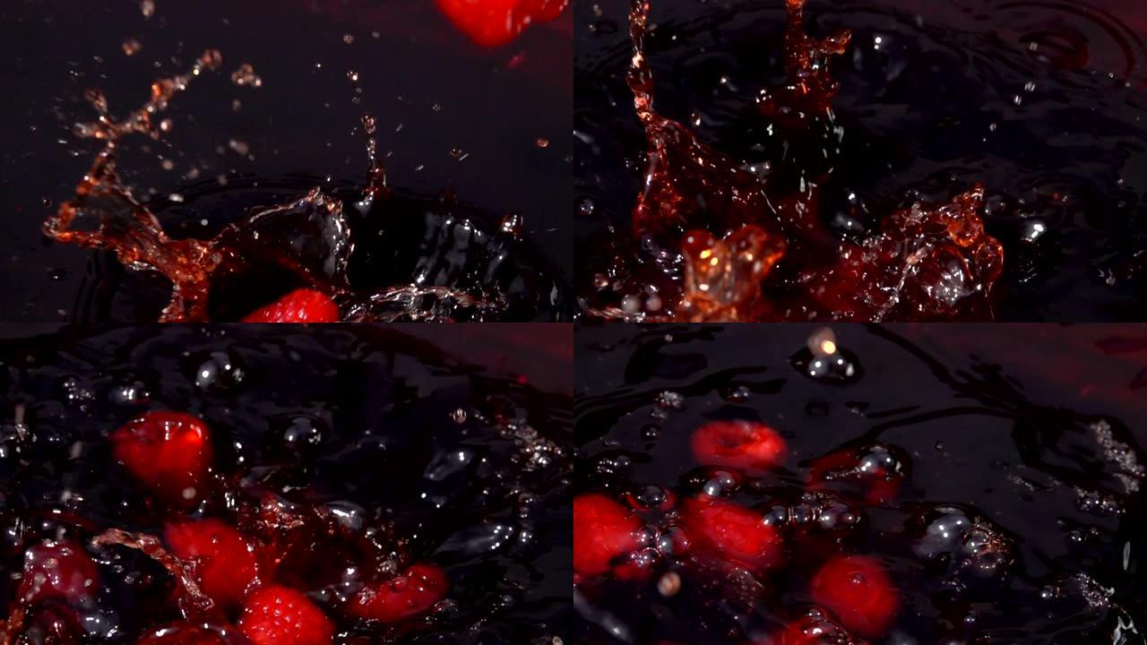 成熟的红色覆盆子掉入果汁中，并带有美丽的飞溅