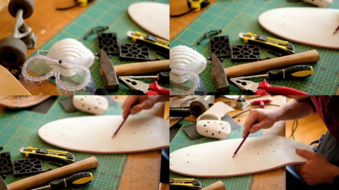 一个年轻人的工具和他在滑板车间工作的特写镜头