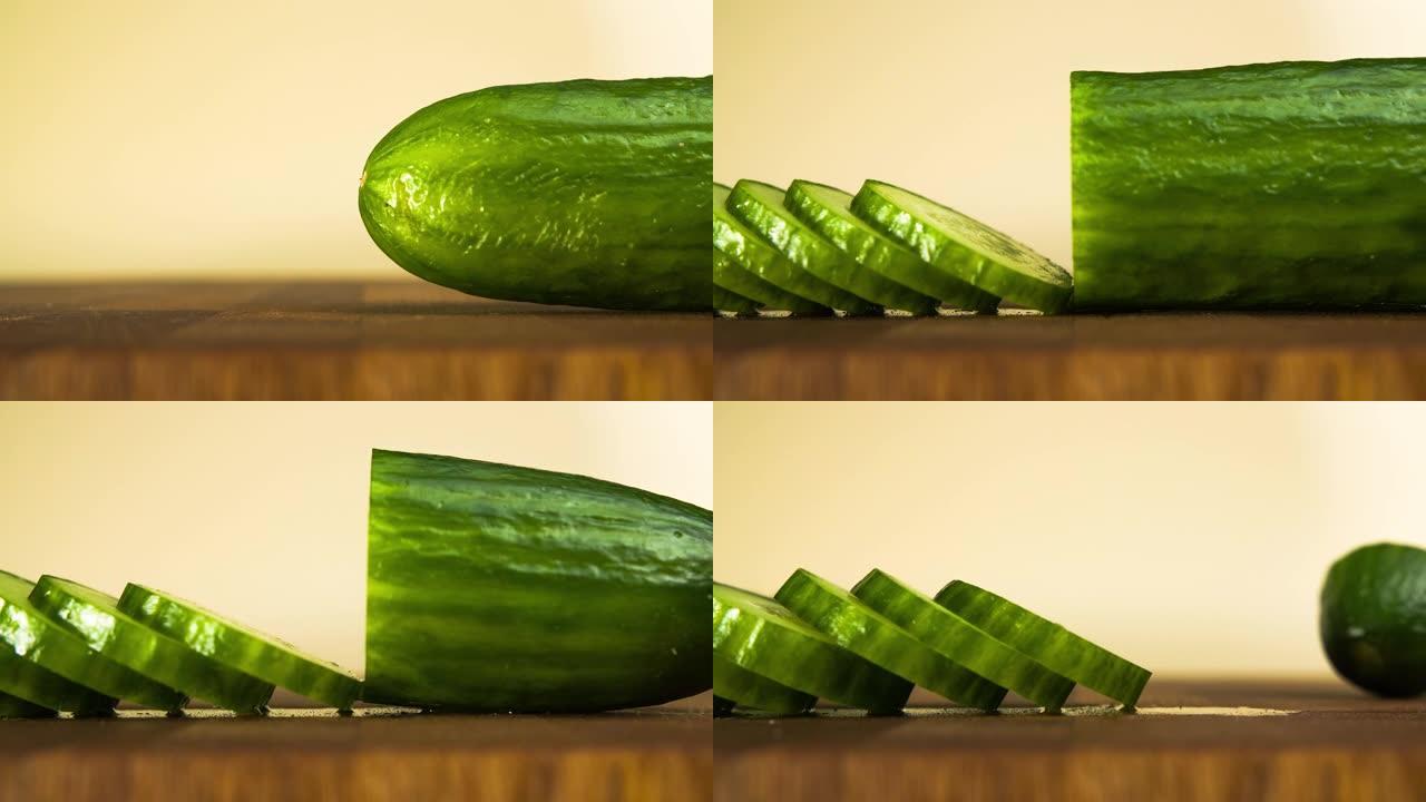 切碎黄瓜。木菜板上切片蔬菜的特写。停止运动动画