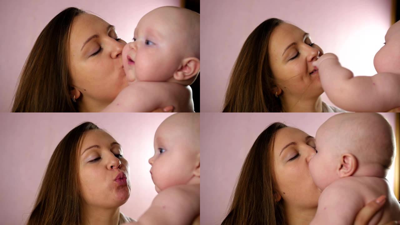 母亲和婴儿。快乐的年轻母亲在家里拥抱婴儿，亲吻胖乎乎的脸颊。特写镜头。