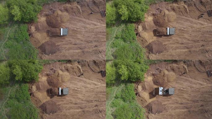 最佳航拍: 翻车机在准备建造住宅的地方倒出土壤。4K