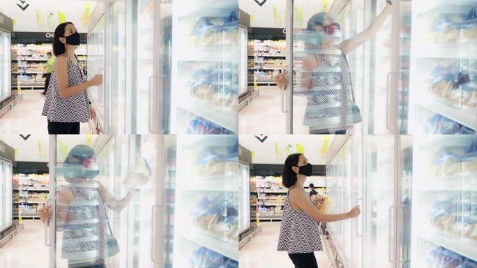 4k年轻的亚洲妇女与医疗保护口罩在杂货店购买和购物。