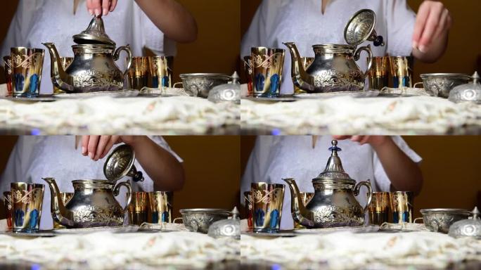 年轻女孩在摩洛哥环境中准备茶